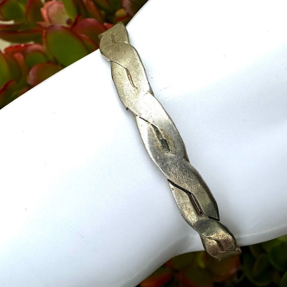 Silver tone braided bangle bracelet
